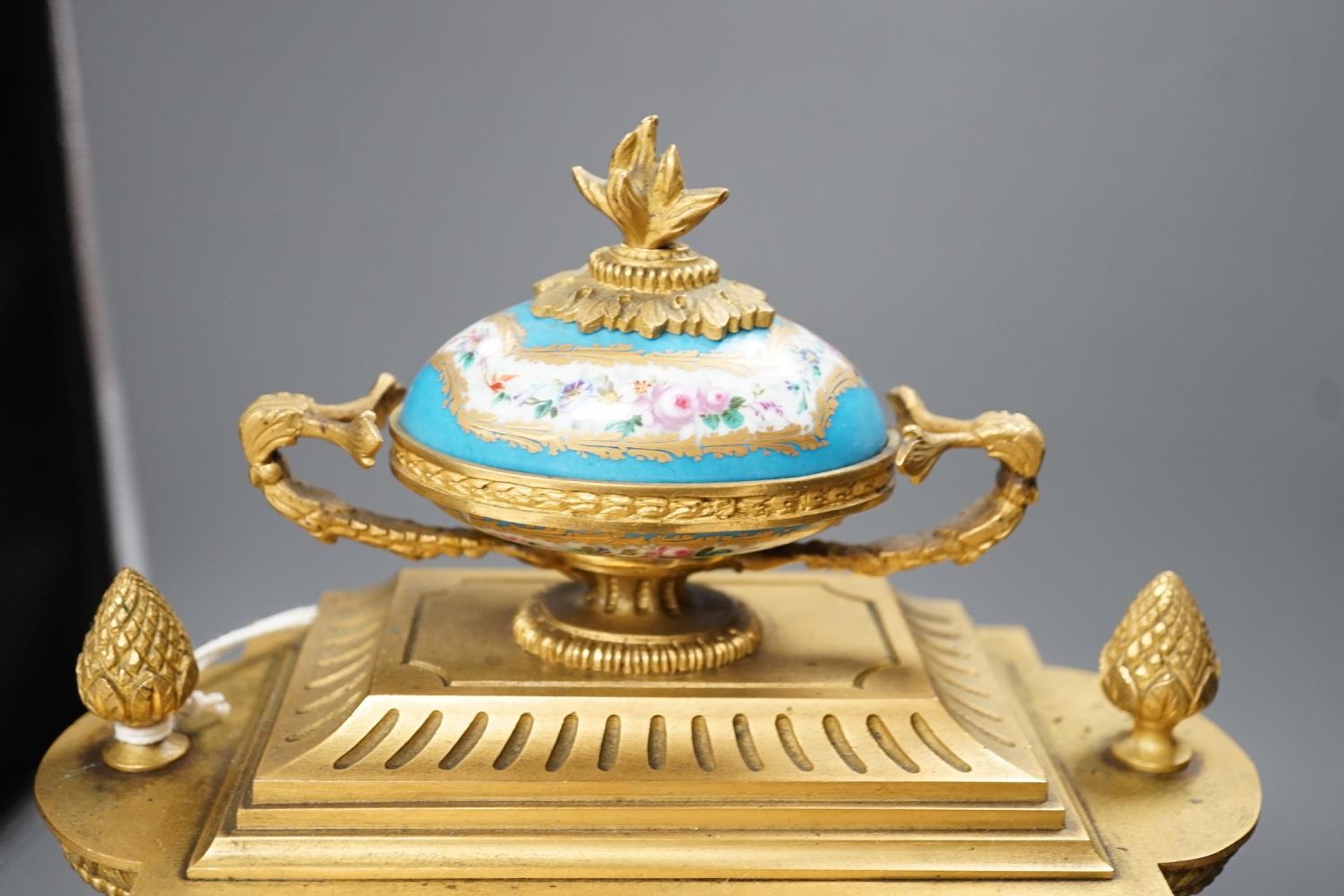 A French ormolu mantel clock, with inset floral decorated porcelain plaques and dial, 40cms high - Image 3 of 7