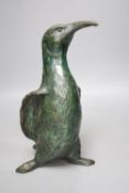 A green patinated bronze model of a penguin, monogrammed and numbered 3/6 29cm