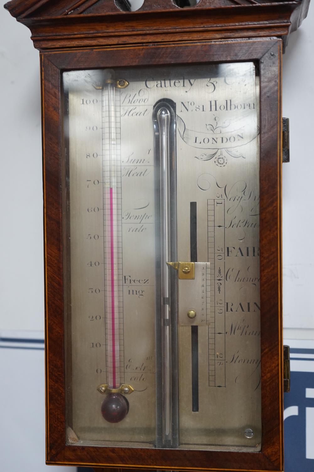 Cattely & Co, Holborn, London. A George III feathered walnut stick barometer, height 98cms. with - Image 2 of 3