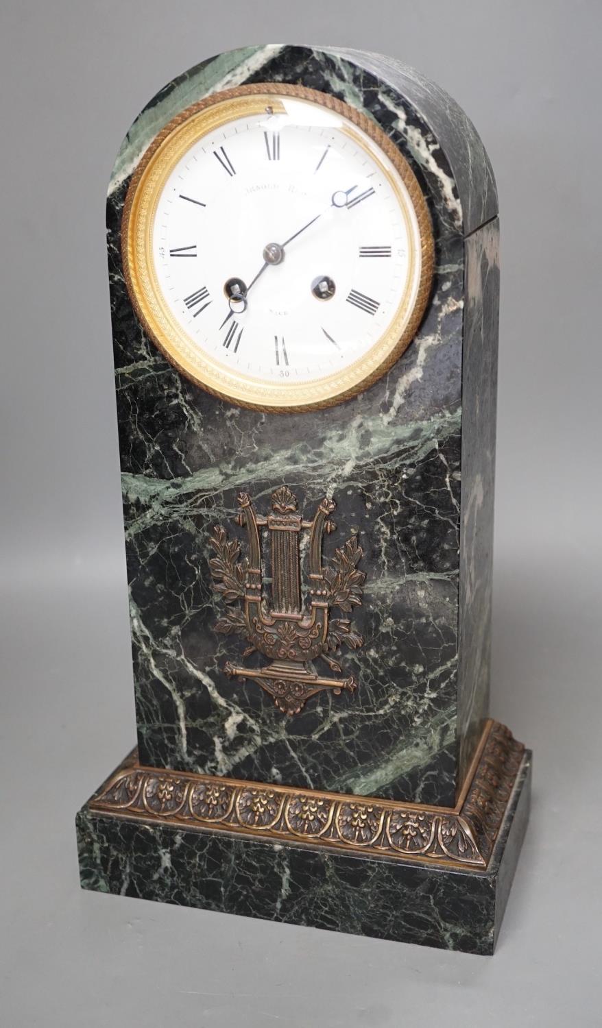 A 19th century French bronze mounted dome topped, green marble mantel clock, the enamel dial