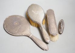 A George V silver mounted hand mirror and similar hair and clothes brush, Adie Bros. Birmingham,