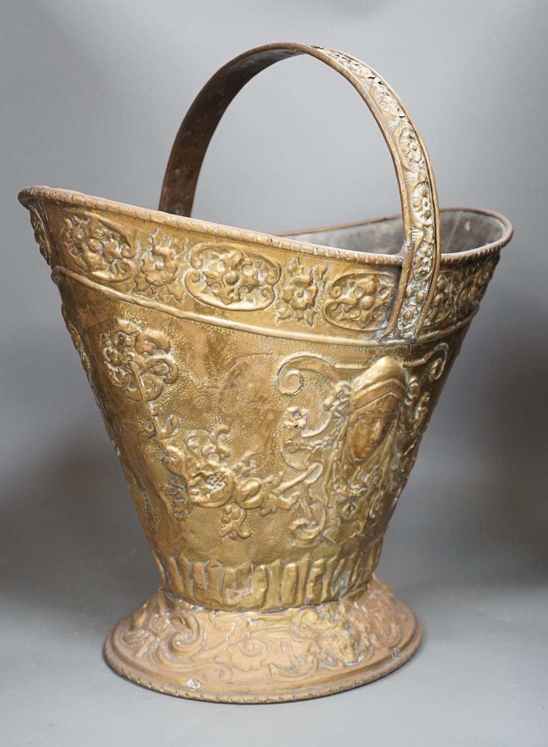 An embossed brass helmet coal bucket, 48cms high - Image 4 of 6