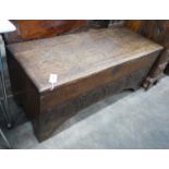 A late 17th / early 18th century carved six plank oak coffer width 115cms, depth 44cms, height