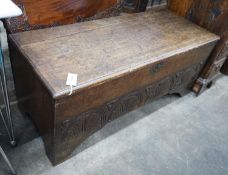 A late 17th / early 18th century carved six plank oak coffer width 115cms, depth 44cms, height
