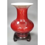 A 19th century Chinese sang de boeuf vase of squat baluster form with everted rim (a.f.), on