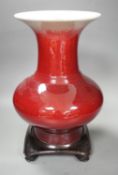 A 19th century Chinese sang de boeuf vase of squat baluster form with everted rim (a.f.), on