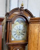 A George III mahogany eight day longcase clock, with an arched brass dial, height 246cm