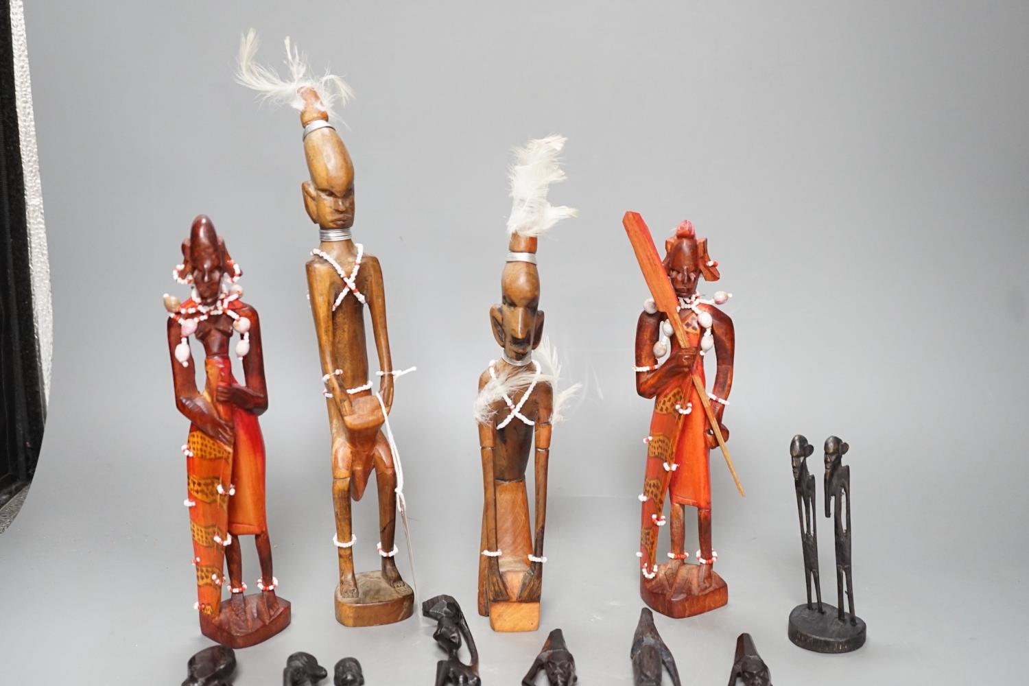 12 African carved wood stick figures, tallest 38cms high - Image 2 of 7