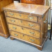 An early 18th century style feather banded walnut bachelor's chest, width 76cm, depth 34cm, height