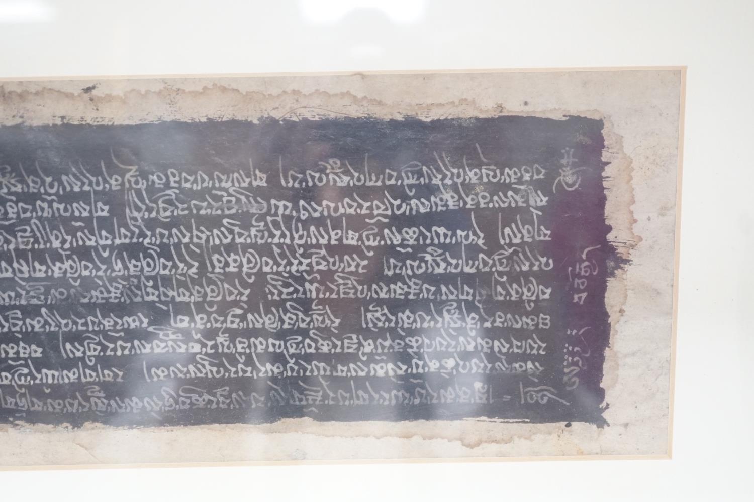 A framed Tibetan Sanskrit sutra panel, 45cms x 13cms. - Image 4 of 5