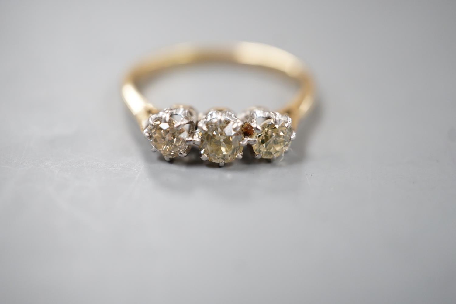 An 18ct and three stone diamond set ring, size P, gross weight 2.8 grams. - Image 2 of 5