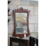 A George III style mahogany fret cut wall mirror width 45cms, height 75cms.