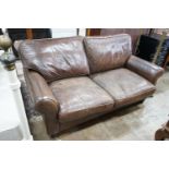 A Laura Ashley brown leather sofa bed, width 170cm, depth 96cm, height 86cm