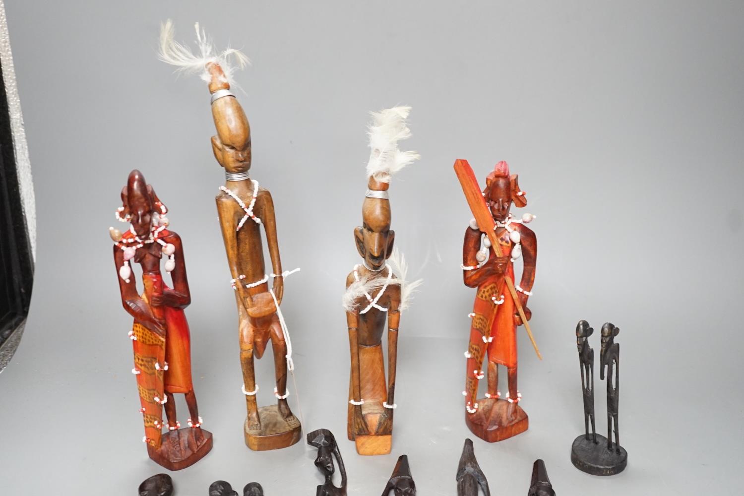 12 African carved wood stick figures, tallest 38cms high - Image 5 of 7