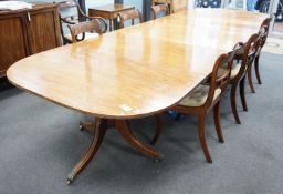 A George IV mahogany triple pedestal extending dining table, length 341cm extended, two spare