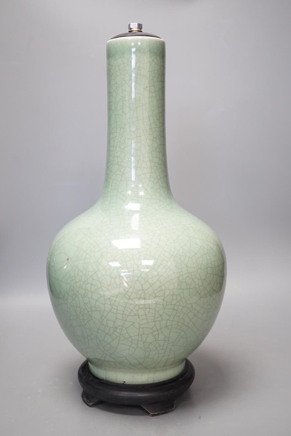 A Chinese celadon glazed Guan type vase on stand, 42 cms high - Image 2 of 4