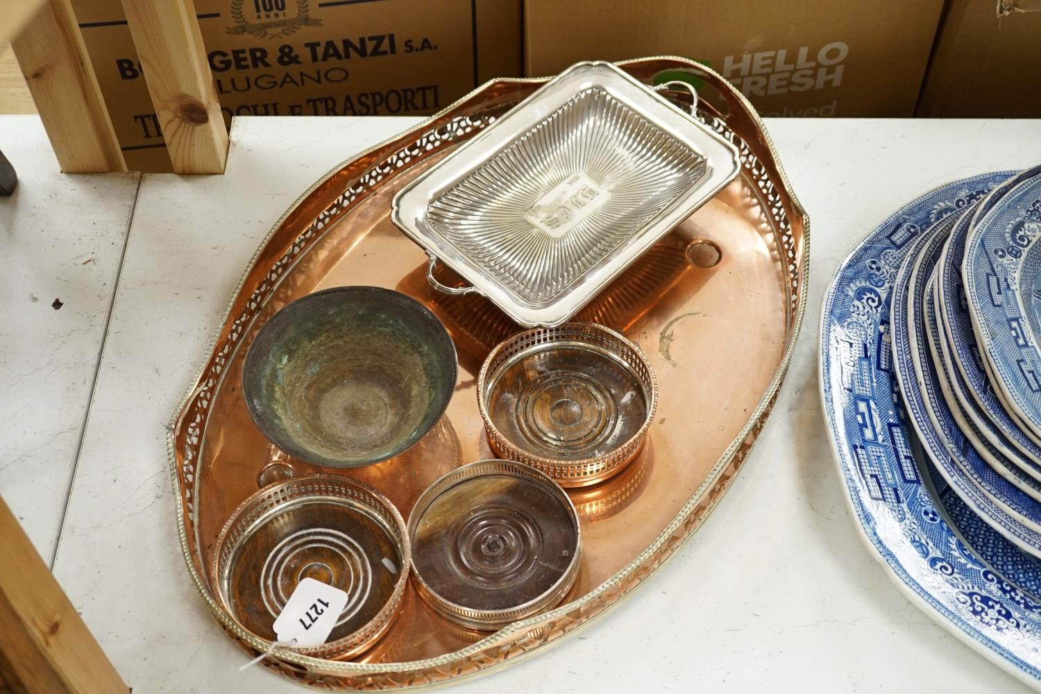 Three copper coasters, an oval tray plated bowl and entree dish,