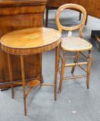 A Victorian caned beech child's correction chair and an Edwardian inlaid mahogany oval occasional