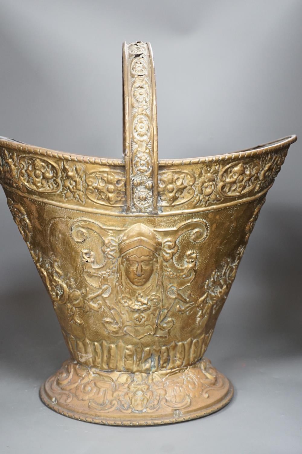 An embossed brass helmet coal bucket, 48cms high - Image 2 of 6