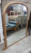 A Victorian style giltwood and composition overmantel mirror, width 136cms, height 138cms.