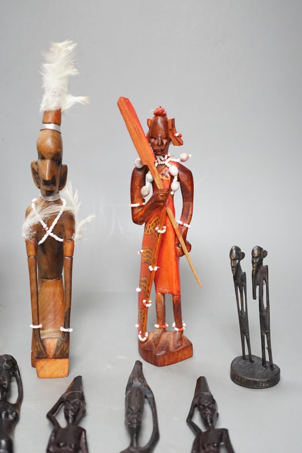 12 African carved wood stick figures, tallest 38cms high - Image 7 of 7