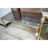 A brass and smoked glass rectangular coffee table, width 99cm, depth 51cm, height 42cm