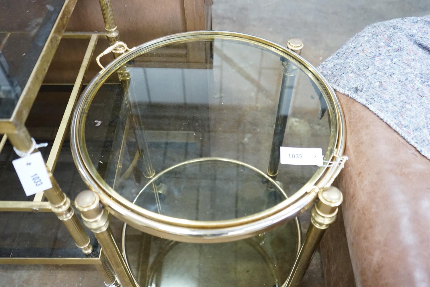 A circular smoked glass and brass tray top two tier occasional table, diameter 57cm, height 64cm - Image 2 of 3