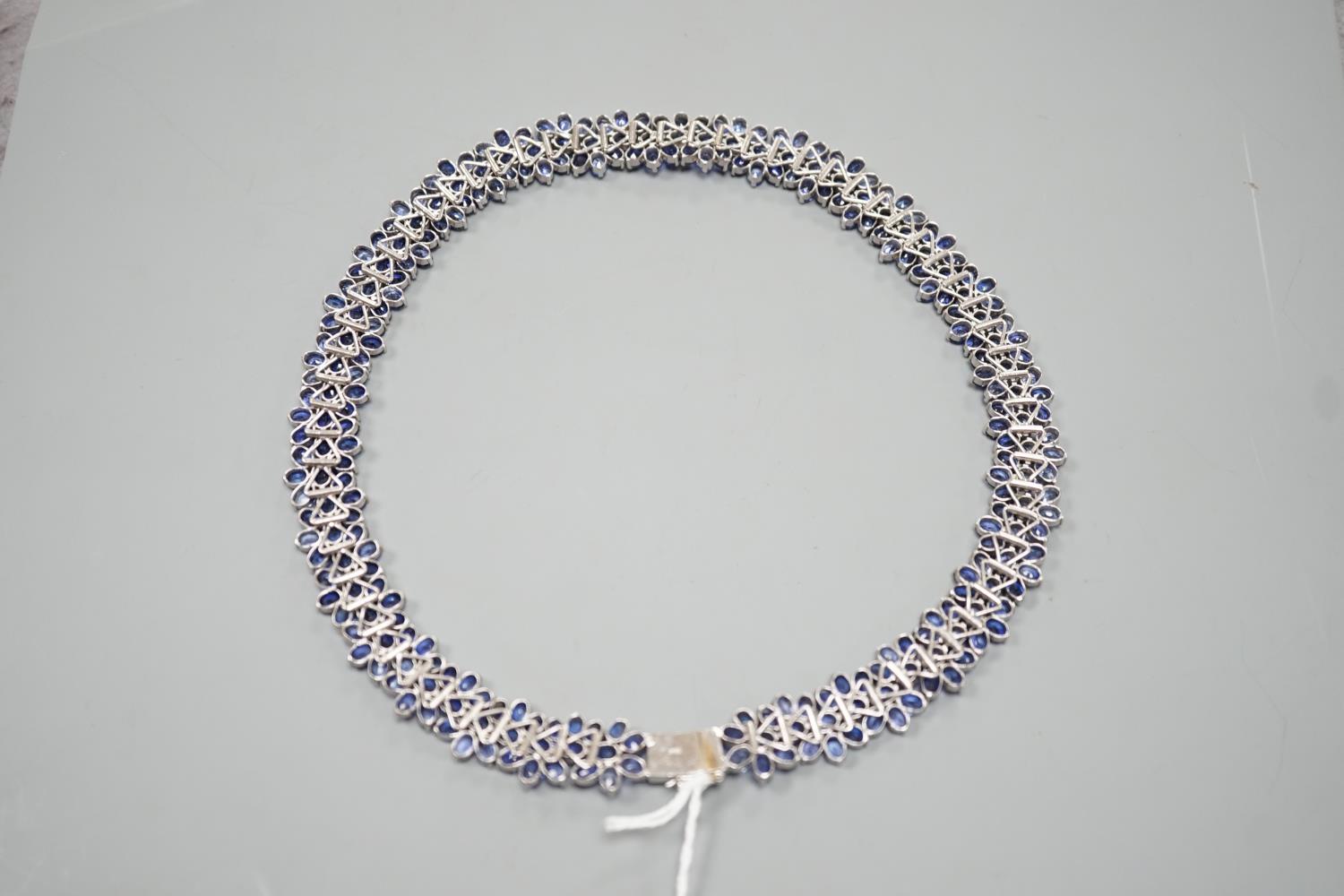 A continental base metal and synthetic sapphire? flower head cluster set necklace, approximately - Image 4 of 4