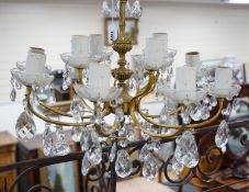 A cut glass eight branch twelve light chandelier, 39cms high