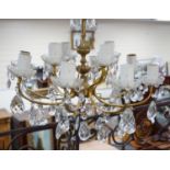 A cut glass eight branch twelve light chandelier, 39cms high