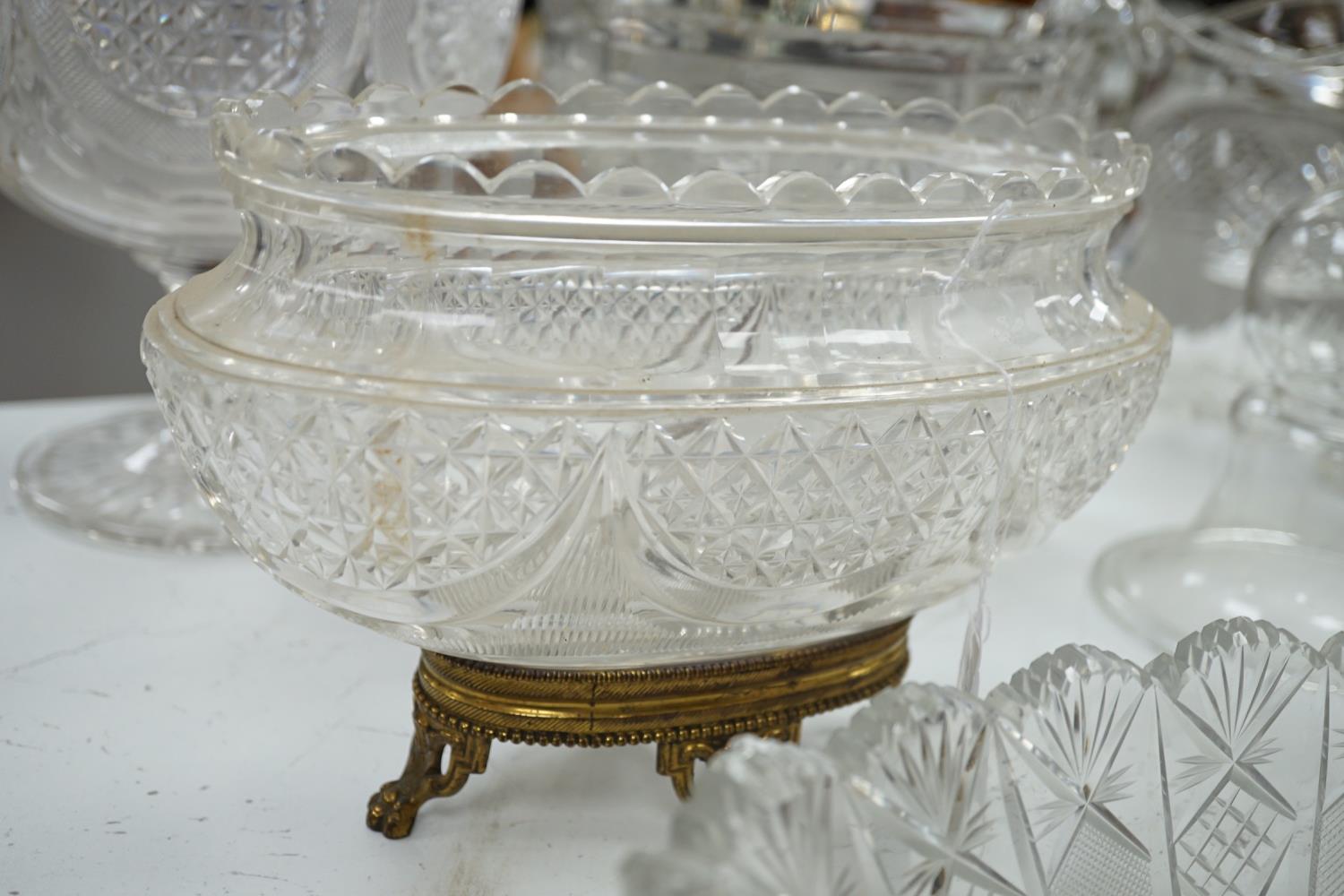 An early 20th century oval cut glass bowl on gilt metal stand, a pair of slice cut decanters and - Image 5 of 6