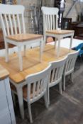 A modern John Lewis part painted extending dining table and eight matching chairs, table width
