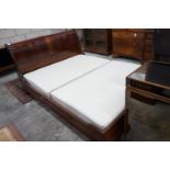 An 'And So To Bed' mahogany kingsize sleigh bed with Prestige two section divan base, width
