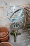 Twelve assorted terracotta garden planters with assorted dish bases, a metal sphere on cast iron