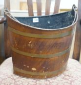 A Regency Toleware bucket with simulated mahogany and brass effect