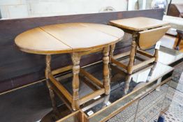 A pair of 18th century style oak drop flap occasional tables width extended 68cms, depth 50cms,