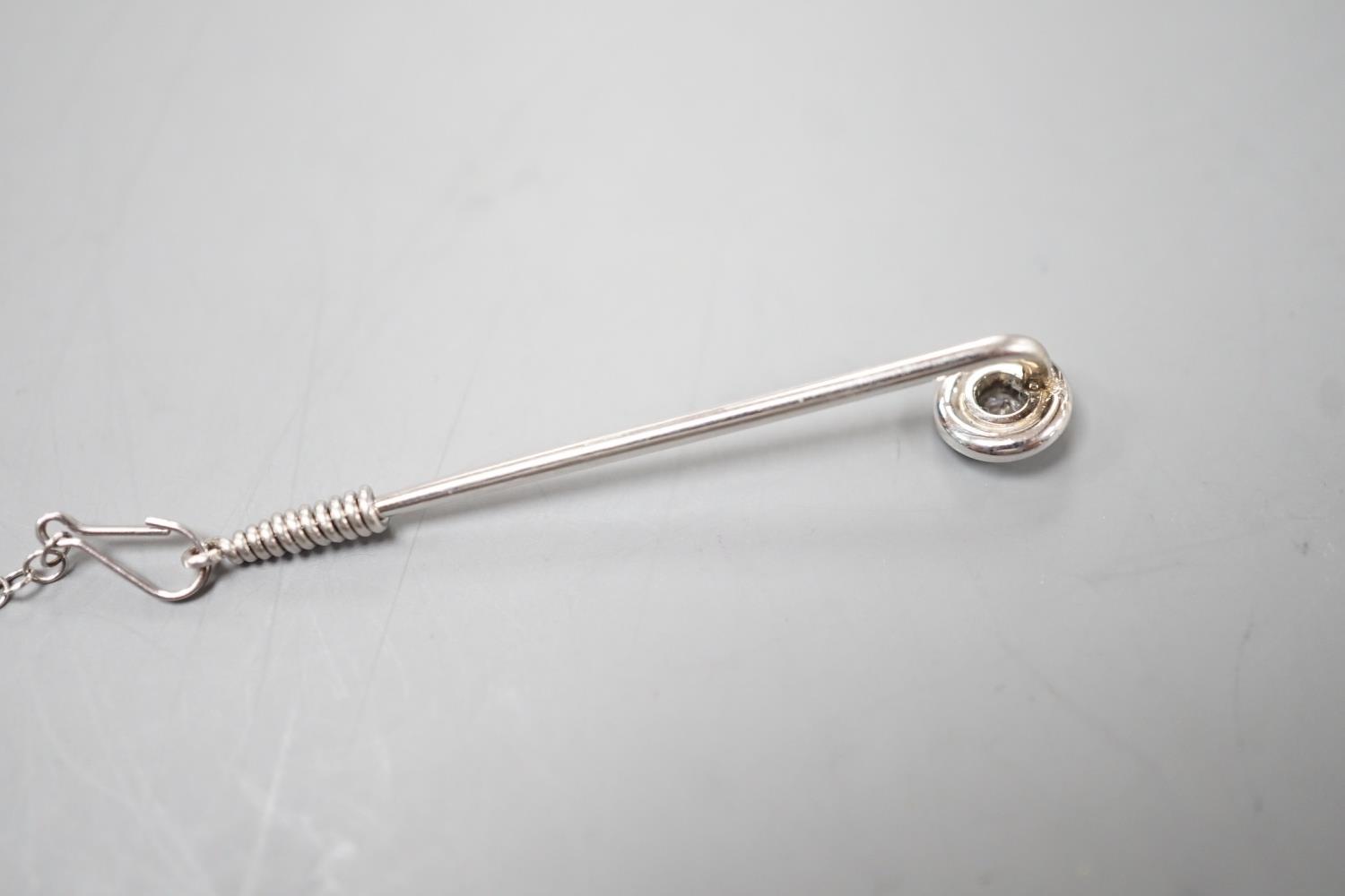 A white metal and collet set solitaire diamond tie pin, 43mm, with safety chain, gross weight 2.1 - Image 3 of 3