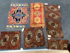 Five antique Afghan carpet fragments, a Caucasian fragment and a Turkish mat, largest 86cms x