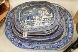 A 19th century transfer-printed large blue and white platter and seven similar smaller platters (8),