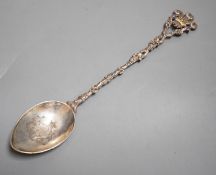 A late Victorian silver and enamelled spoon, with rustic stem and Prince of Wales feathers terminal,