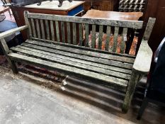A weathered teak garden bench, length 194cm, height 83cm (a.f.)
