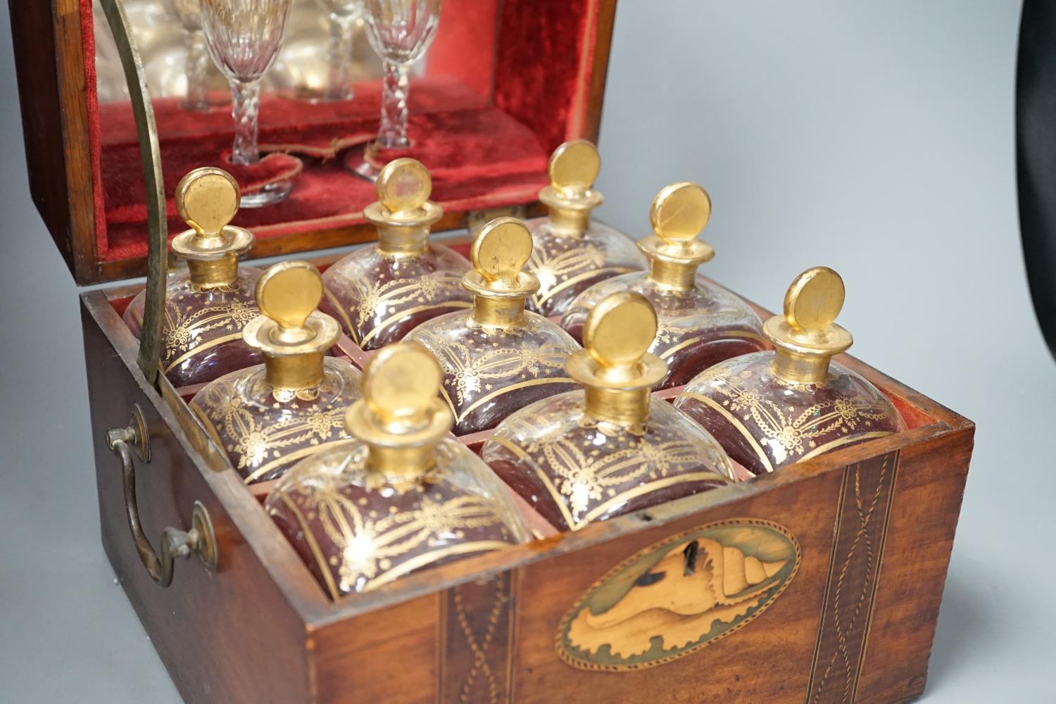 A 19th century Dutch inlaid mahogany decanter box containing nine gilt glass decanters and two - Image 2 of 5