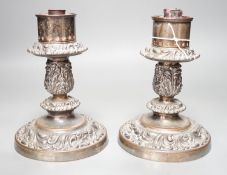 A pair of Victorian silver plated ships storm light candlesticks, glass funnels missing, 19cms high