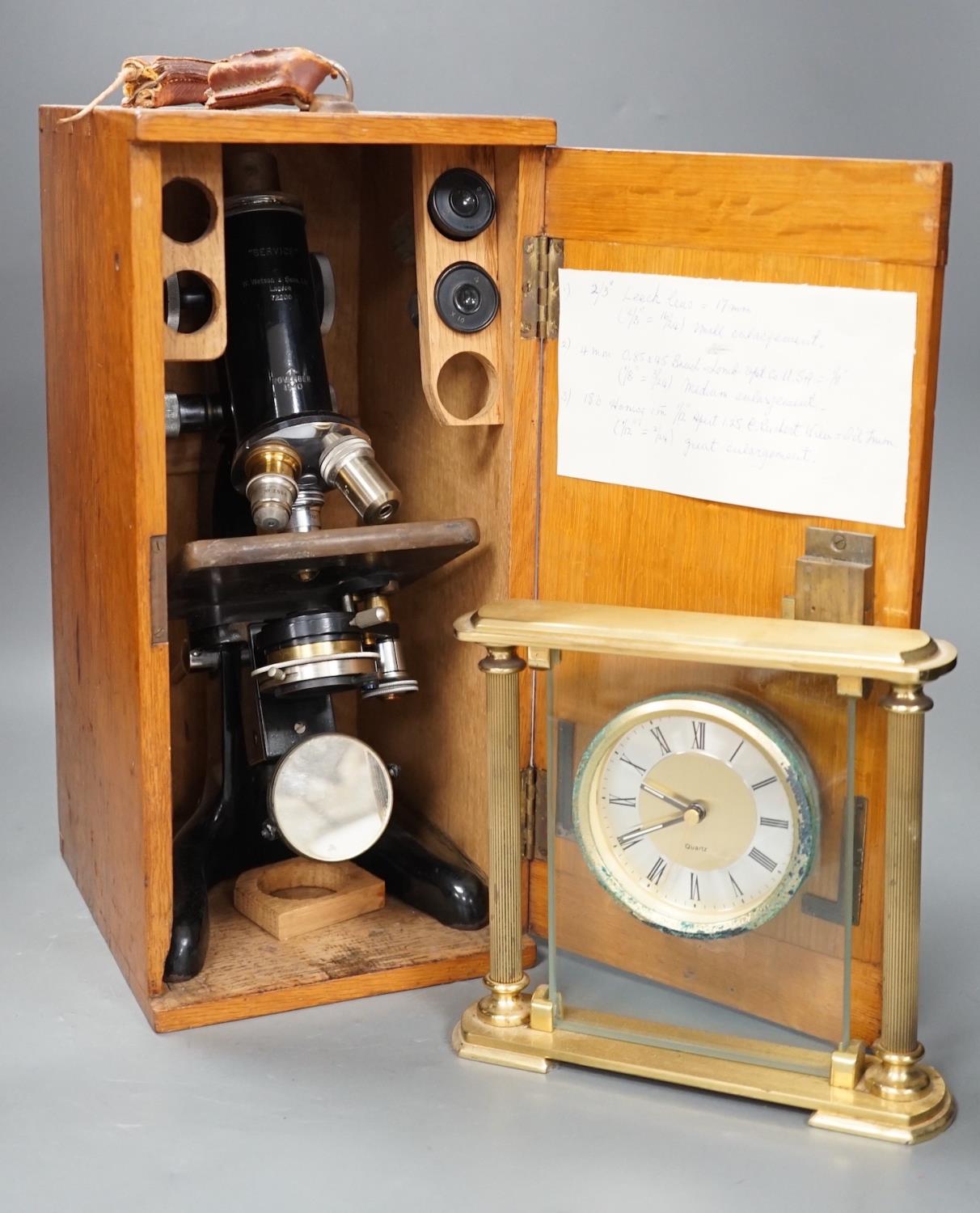 An oak-cased black japanned microscope, case 35cm high, width 16cm, 20cm depth and a brass mantel