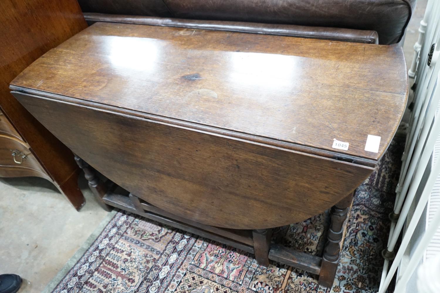 An 18th century oak gateleg dining table, length 141cm extended, width 120cm, height 74cm - Image 2 of 3