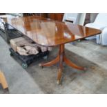 A reproduction Tillman style mahogany twin pillar extending dining table 246cms extended, two