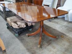 A reproduction Tillman style mahogany twin pillar extending dining table 246cms extended, two