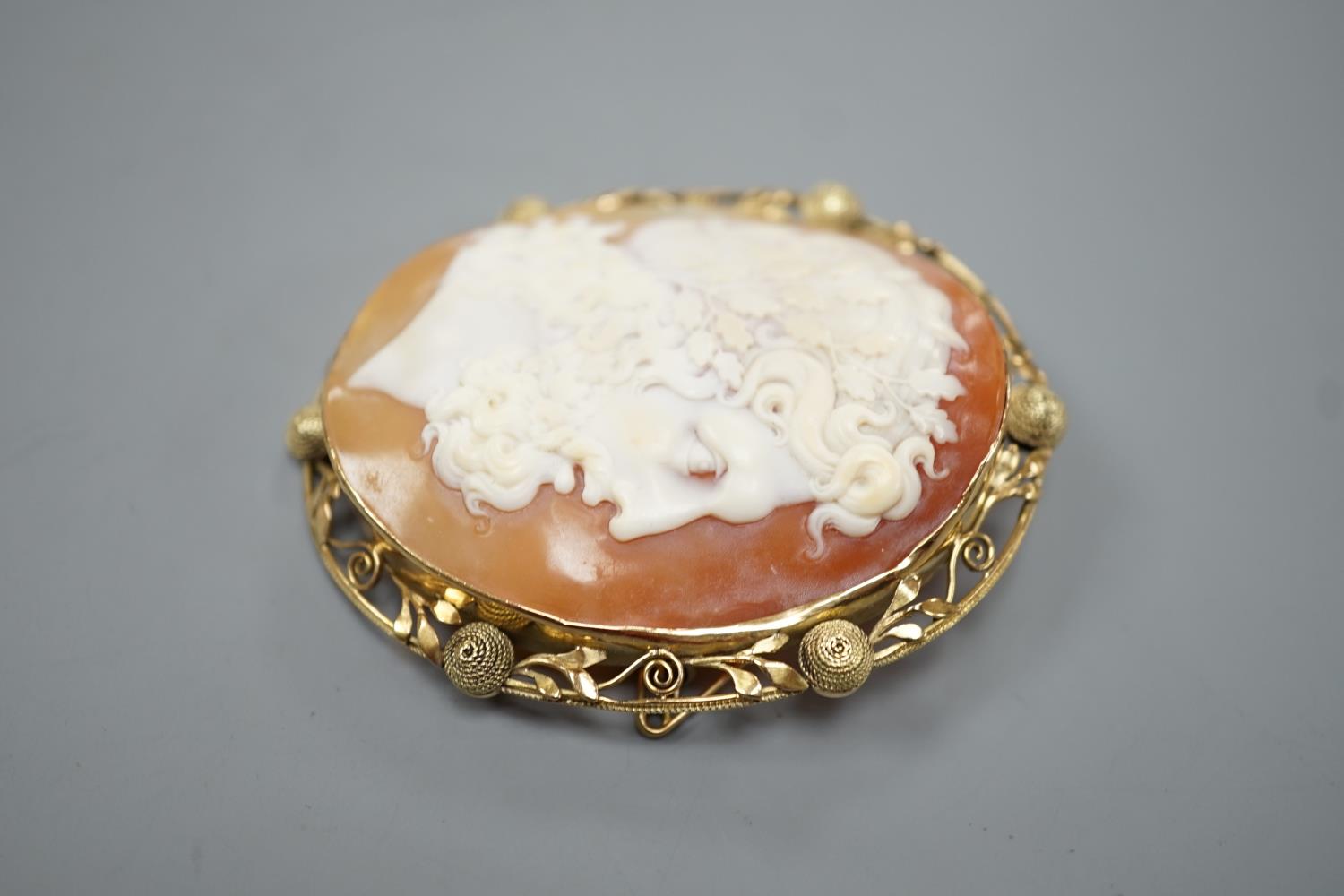 After the antique- A yellow metal mounted oval cameo shell brooch, carved with the head of a Zeus to - Image 2 of 3