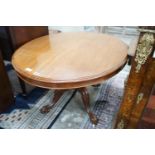 A Victorian mahogany oval tilt-top loo table width 134cms, depth 104, height 72cms.