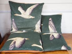 Two pairs of cushions decorated with geese